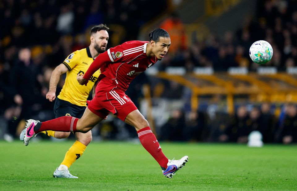 Liverpool's Virgil van Dijk in action with Wolverhampton Wanderers' Adam Armstrong